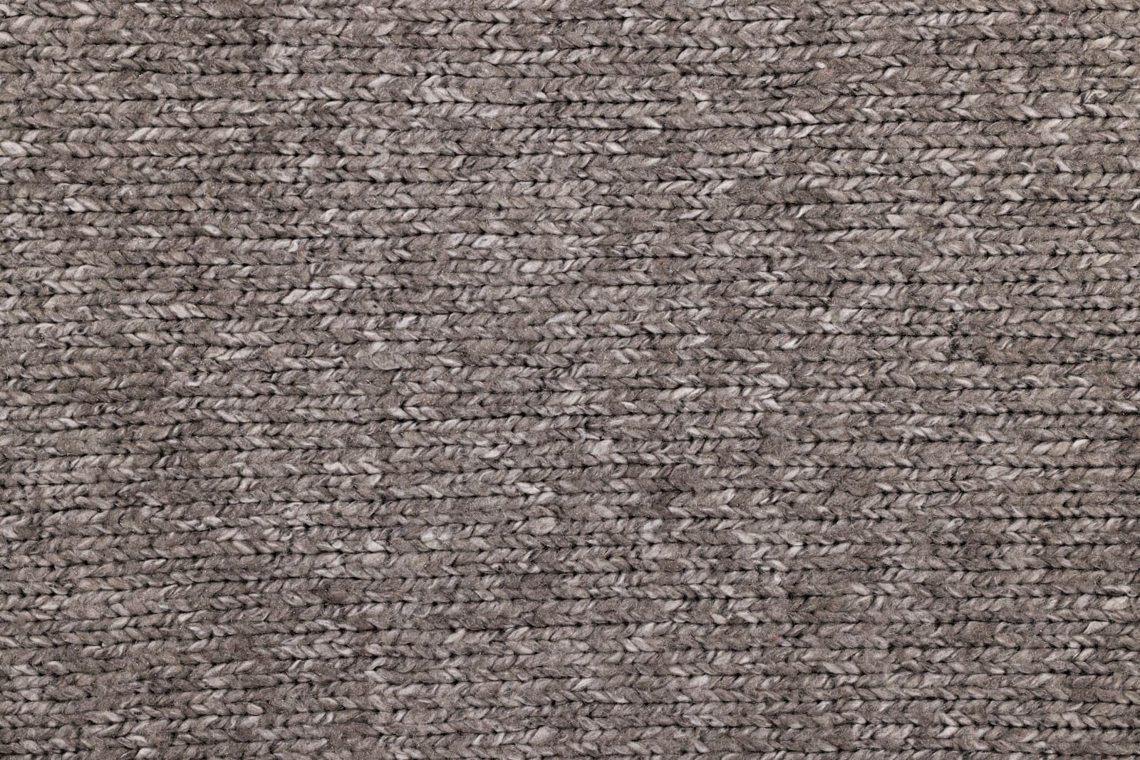Close detail of a dense grey loop-pile textile.